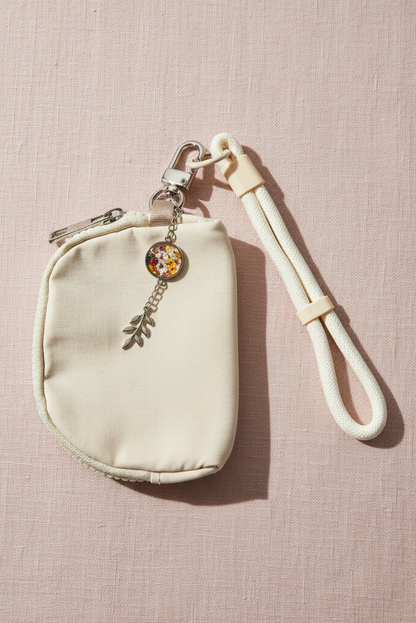 Wristlet wallet with wrist strap and with medallion that has flowers bouquet photo | silver color | My Sparkling Corner

